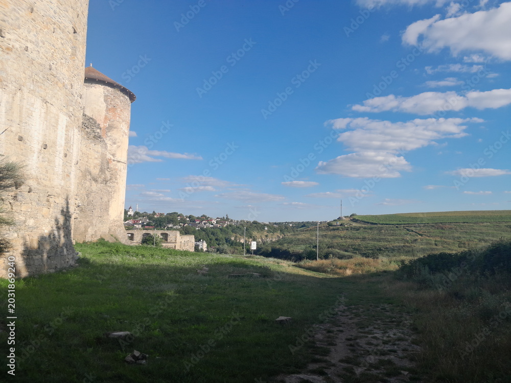 Fototapeta premium stone fortress wall under blue sky