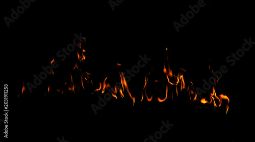 Fotografie Realistic fire flames isolated on black background with glowing orange burn effect