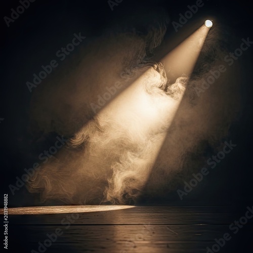Dramatic spotlight beam illuminating smoky scene on a dark background