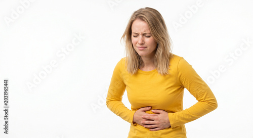 Young Woman Suffering from Acute Pancreatitis Holding Her Stomach in Abdominal Pain on White Background