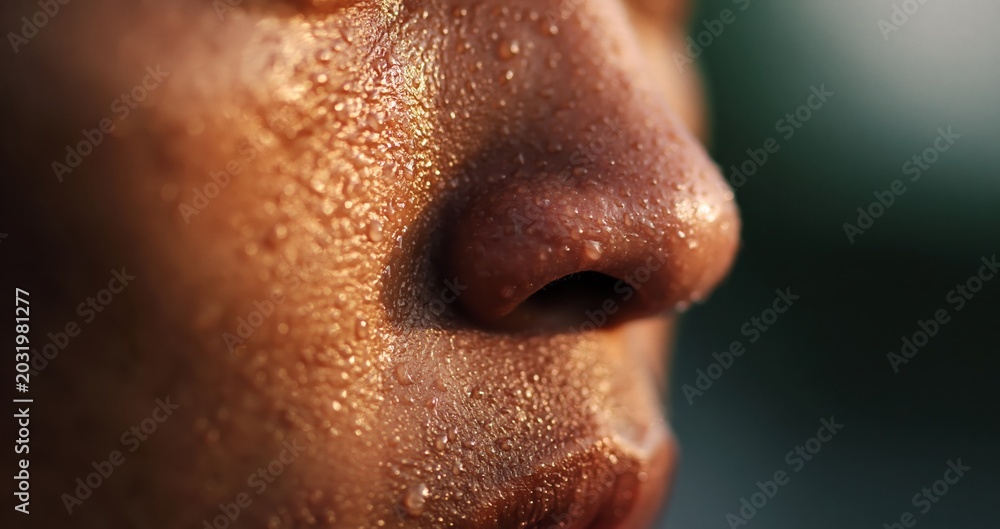 Fototapeta premium Person sweating on face showing skin texture closeup
