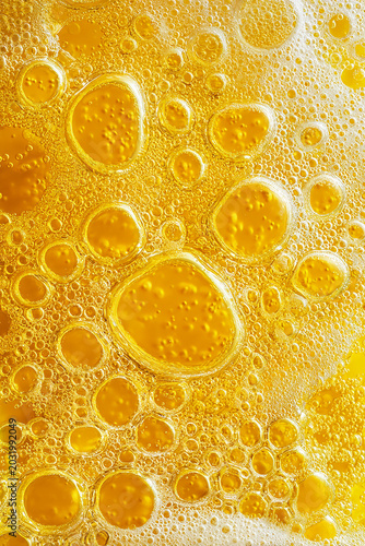 Macro close-up of golden oil and water bubbles forming a luxurious abstract background with vibrant textures and organic patterns.  made with generative AI