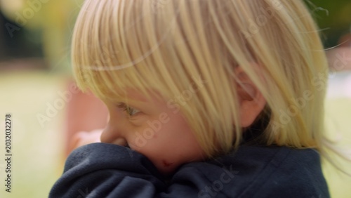 Photos Child covering face. Small kid conceals face with shy demeanor