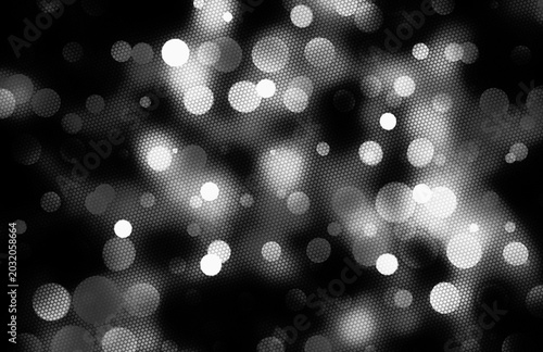 An abstract bokeh design atmospheric background in black and white monochrome