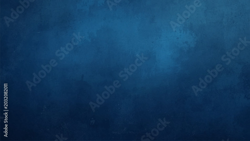 Fotografía Dark blue textured background, gradient and mottled surface.