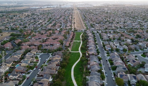 Konstfotografi Aerial view of suburban neighborhood and residential housing development with ce