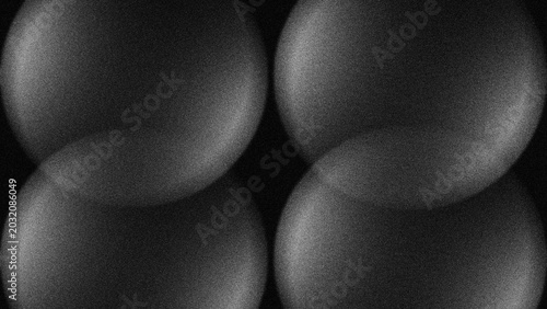 Photos Four smooth spheres glow softly against a dark void