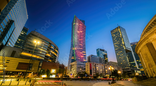 Bild auf Leinwand Business Skyscrapers Lit Up At Night On A Street In Warsaw