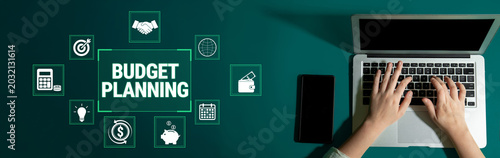 Schilderij op canvas Strategic Budget Planning and Financial Management with Laptop and Tools on Green Background for Effective Money Management Fluxor