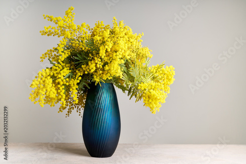 Vase with mimosa flowers