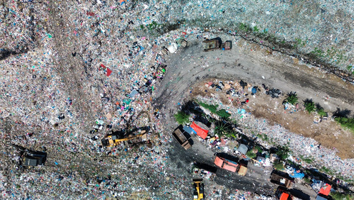 Cuadro en lienzo Drone aerial view of a massive landfill with garbage trucks and heavy machinery