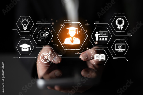 Obraz na płótnie Hands holding smartphone displaying educational icons and symbols representing online learning, graduation, knowledge sharing, and digital transformation in education