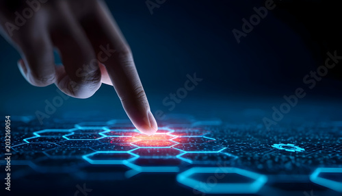Finger touching glowing red hexagon on futuristic blue circuit board background
