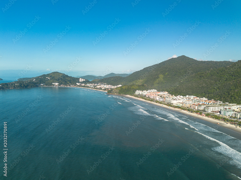 Obraz premium Sunny morning aerial drone view of Praia Grande beach in Ubatuba, Brazil