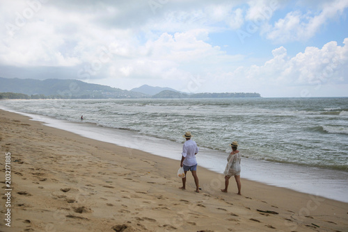 Andaman Sea coast, Bang Tao (Layan) beach, people are walking along the coast Phuket island, Thailand, October 2026