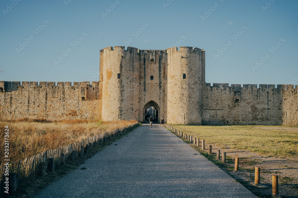 Obraz premium Medieval fortress walls of Aigues-Mortes in southern France at sunset