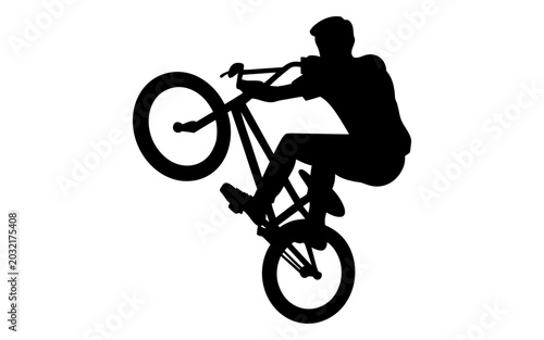 Tableau sur toile Silhouette of a BMX rider performing a wheelie trick on a bicycle, isolated on w
