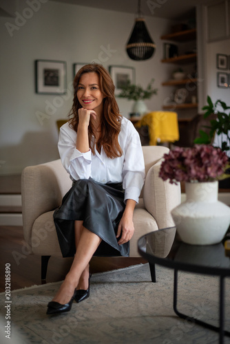 Portrait of a stylish woman in a sophisticated modern living room