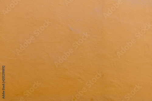 Textured yellow albero plaster wall abstract background from la Macarena in Seville