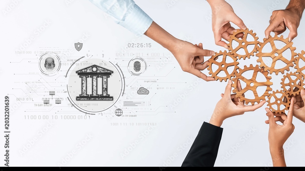 Obraz premium Hands coming together to assemble wooden gears symbolize teamwork and collaboration, set against a digital banking backdrop illustrating innovation and financial growth. Raster