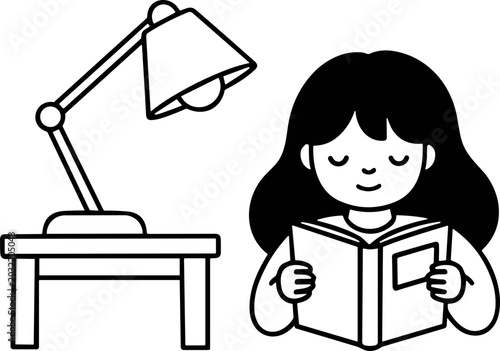 Fotografie Cute girl reading a book under a desk lamp