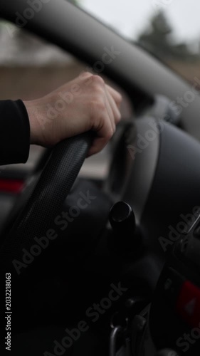 Vertical screen businessman driving car to work close up hands on steering wheel realistic corporate lifestyle transportation scene in morning traffic