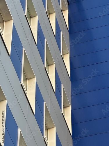 modern office building, White and blue building, many windows