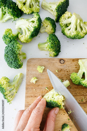 Top View of Cutting Broccoli on a Wooden Board