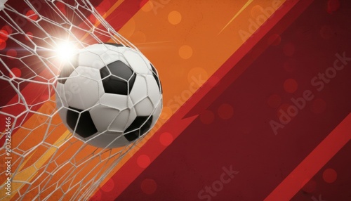Soccer ball hitting goal net with abstract background