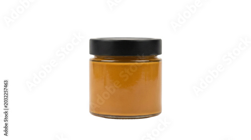 Glass jar with black lid filled with golden honey or spread, isolated on transparent background, ready for stickers, clipart, print on demand, and t-shirt design use.