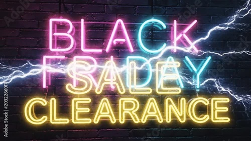 Neon sign advertising sale events on a dark background