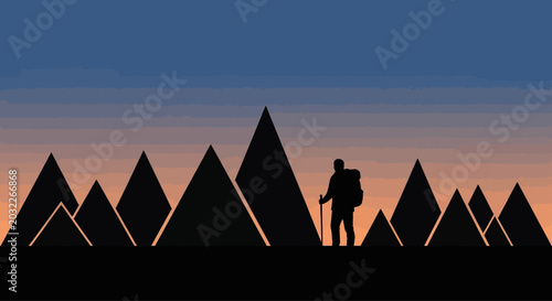 Photos Silhouette of a lone hiker with a backpack and walking stick.