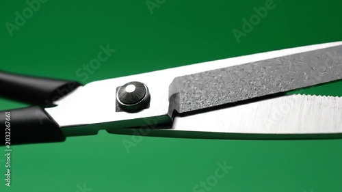Close up of scissors on green background for creative concepts