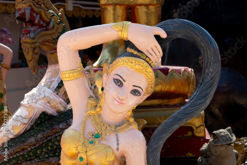 Phra Mae Thorani (Earth Goddess) statue at Wat Phra That Doi Kham, Chiang Mai, Thailand