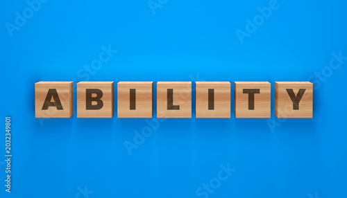 Photos Wooden Blocks Spelling ABILITY: A word spelled out on individual wooden blocks against a vibrant blue background, conveying a message of skill and talent