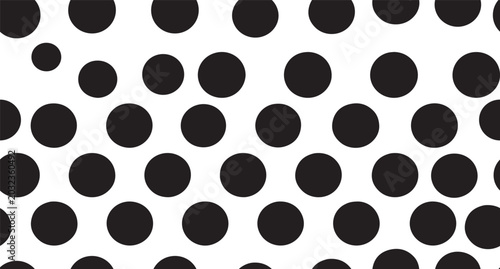 Abstract seamless pattern with black polka dots on a plain surface