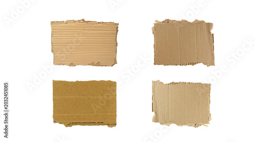 Tableau sur toile Four torn pieces of rough brown cardboard with different textures and corrugatio
