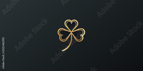 Golden four leaf clover icon on dark gray background