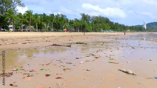 Tropical ocean pollution destroying sandy beach landscapes with extreme garbage Thailand.