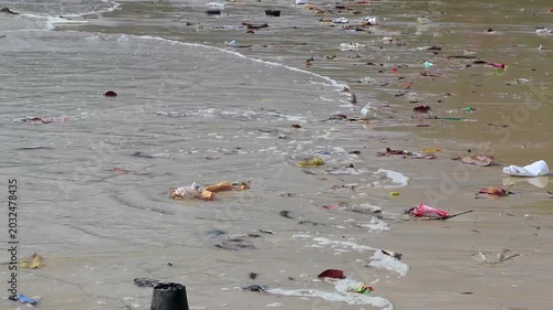 Tropical ocean pollution destroying sandy beach landscapes with extreme garbage Thailand.