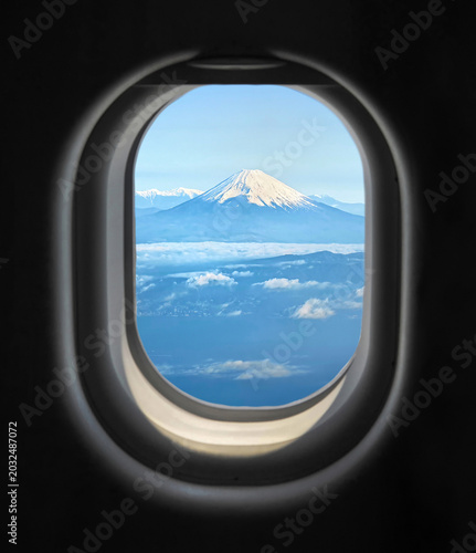 View of Japan's Mount Fuji outside the airplane window.	