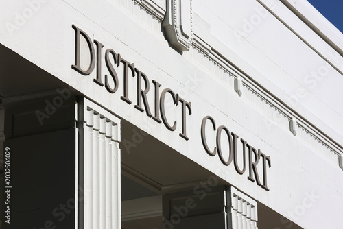 A close-up architectural detail of a historic government building facade showing the 