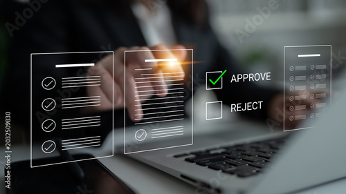 Quadro su tela A business professional engages in a document review process, highlighting approve and reject options on a laptop screen, showcasing modern decision-making in an office setting