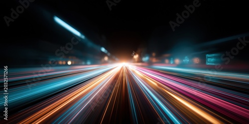 Abstract light trails on a dark highway at night, symbolizing speed and motion