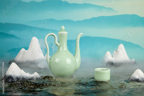 Bild auf Leinwand Celadon Teapot and Cup in Misty Mountain Tea Scene