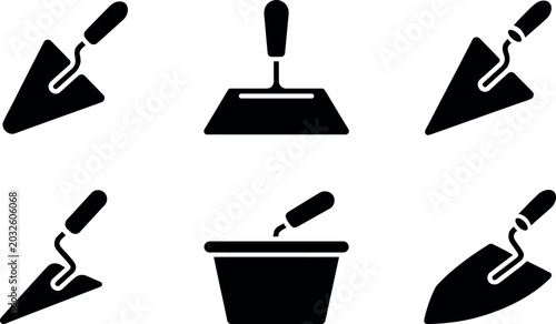 Collection of black silhouette icons representing trowels and a mortar pan for construction work