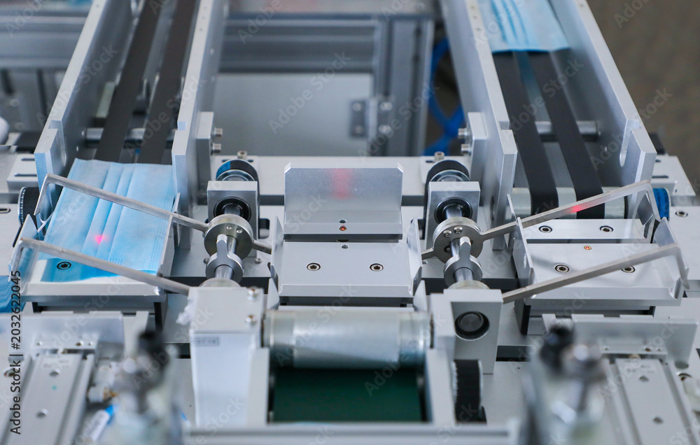 Fototapeta premium Automated conveyor system for disposable face mask production