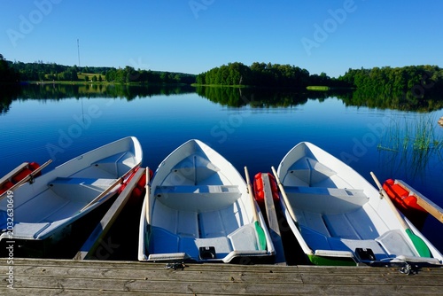 Εκτύπωση καμβά rowboats on a calm lake