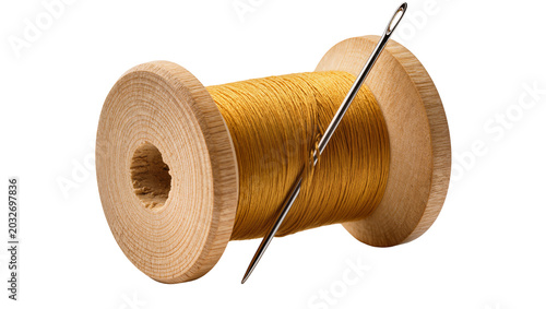 Schilderij op canvas Wooden spool of golden thread with sewing needle