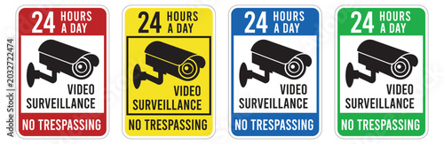 Foto video surveillance signs with security camera icons and no trespassing warnings